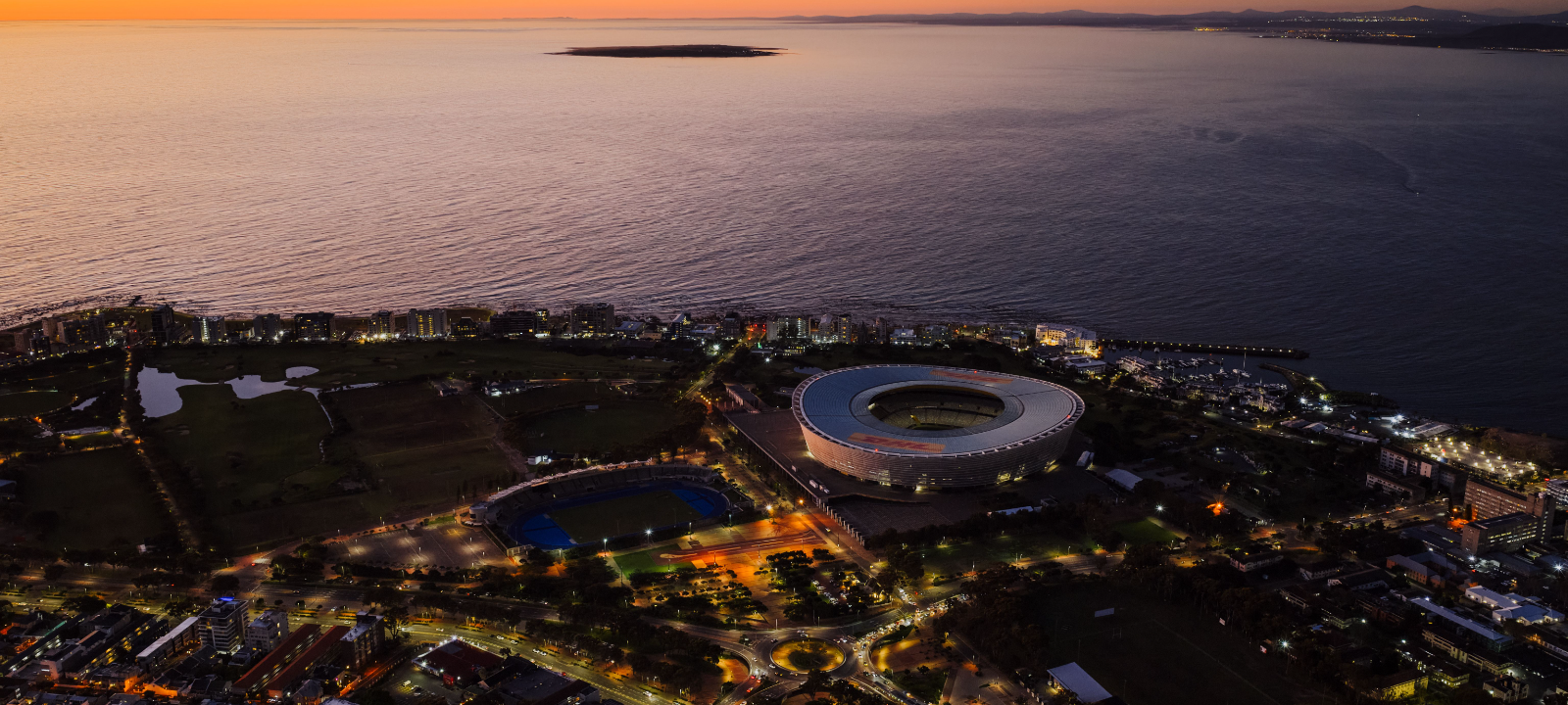 Cape Town city bowl aerial view with DHL Stadium and the Atlantic